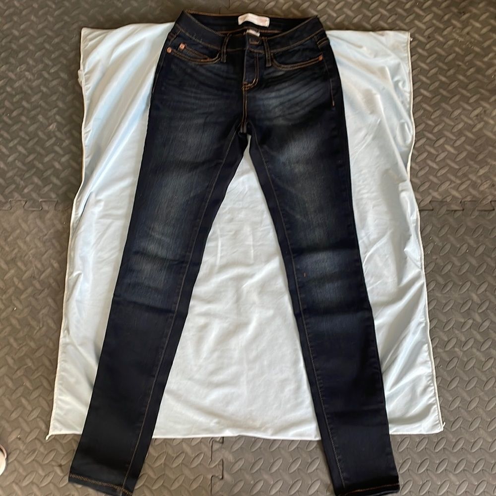 Dark blue stretchy skinny jeans with faded designer spots never worn size 3
